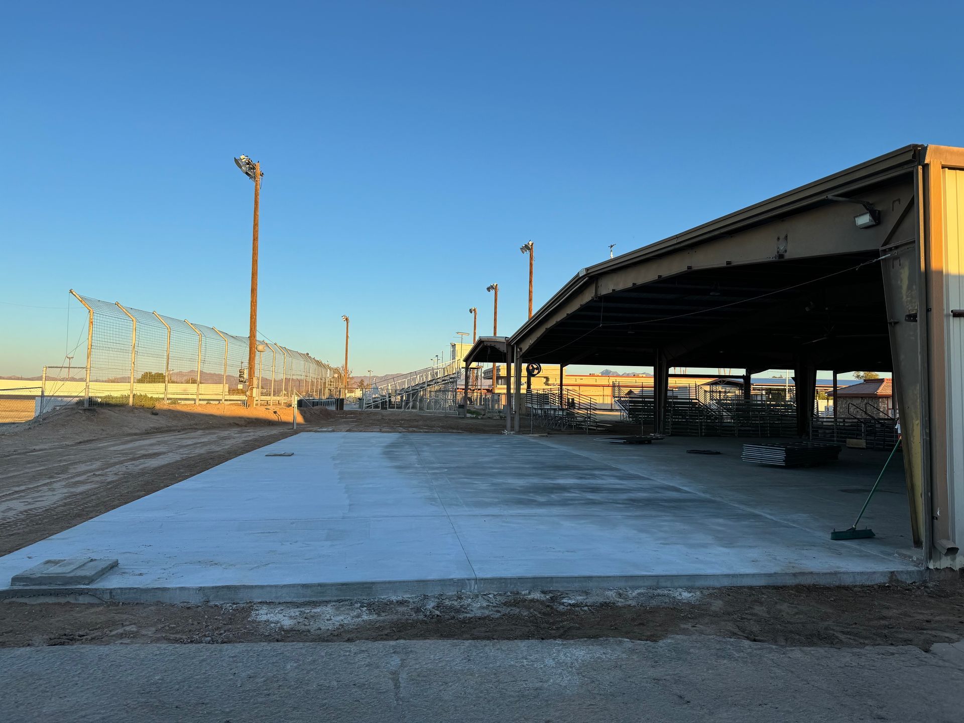 A large building with a concrete floor in front of it.