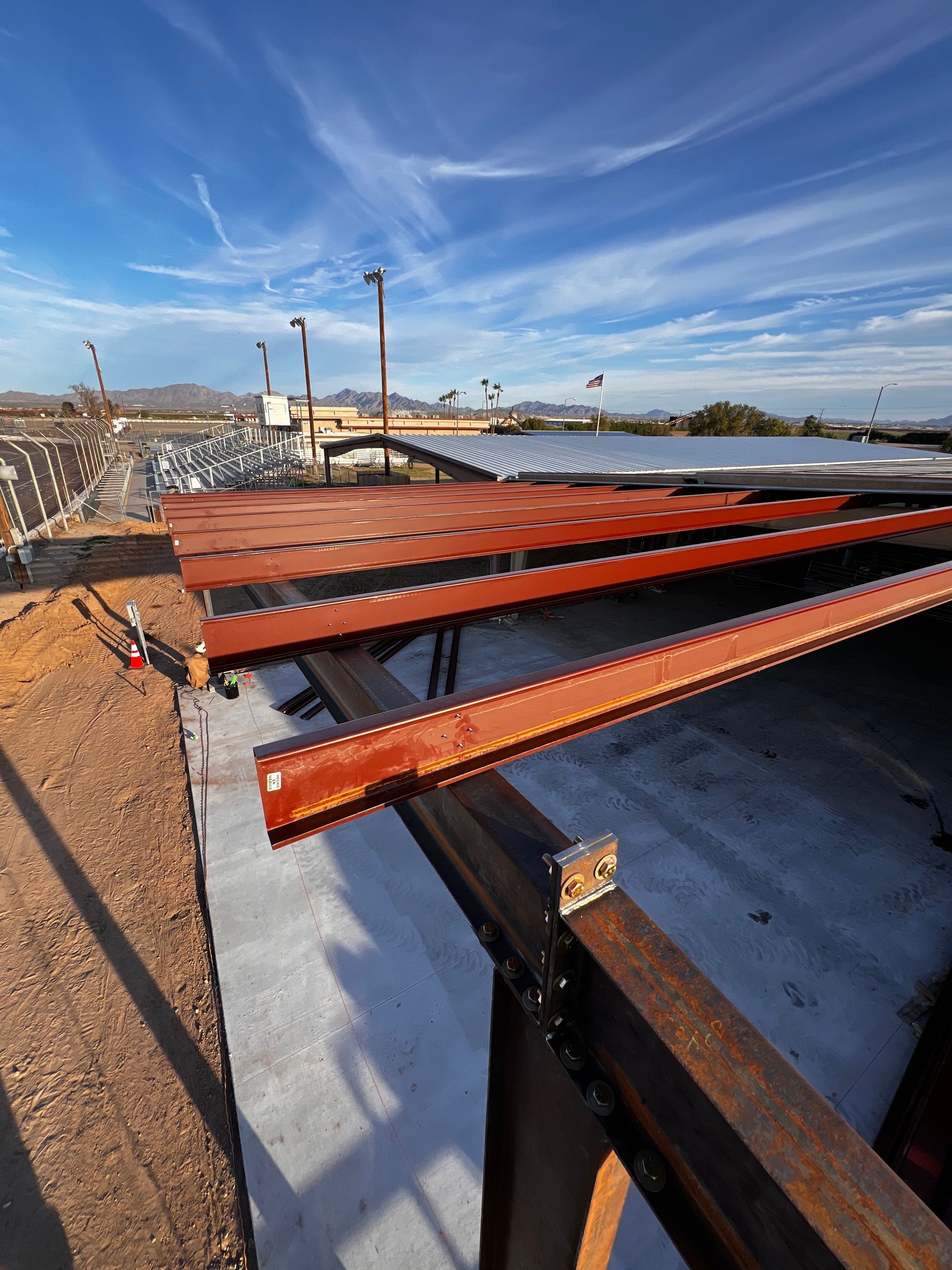 A roof of a building under construction with a blue sky in the background.
