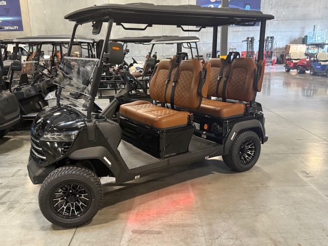 Blue golf cart with beige seats inside a warehouse.