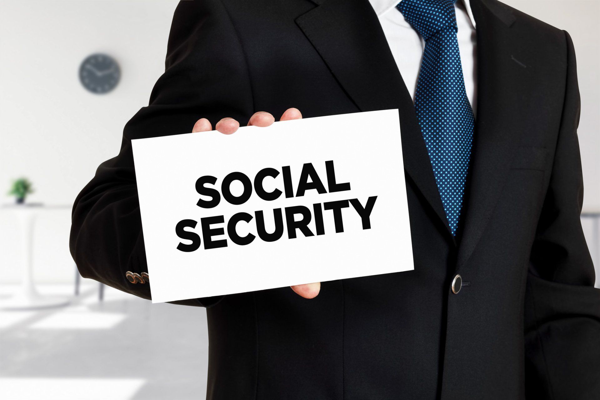 Man Holds Social Security Card – Lafayette, LA – David Bankston LTD PLC