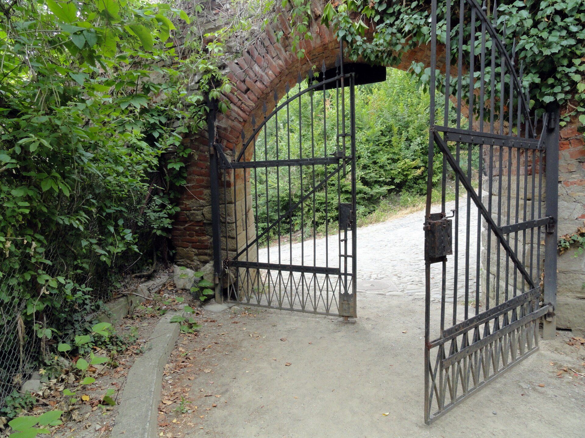 wrought iron arch gateway open