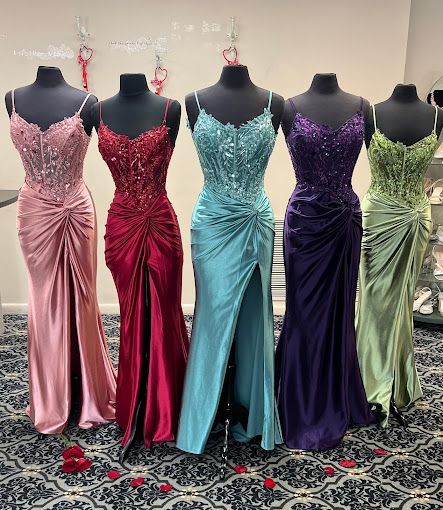 Five different color woman's formal dresses.