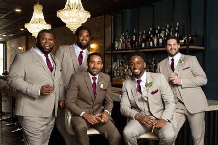 A group of men in suits and ties are posing for a picture - Salina, KS - Princess & Penguin Formalwear