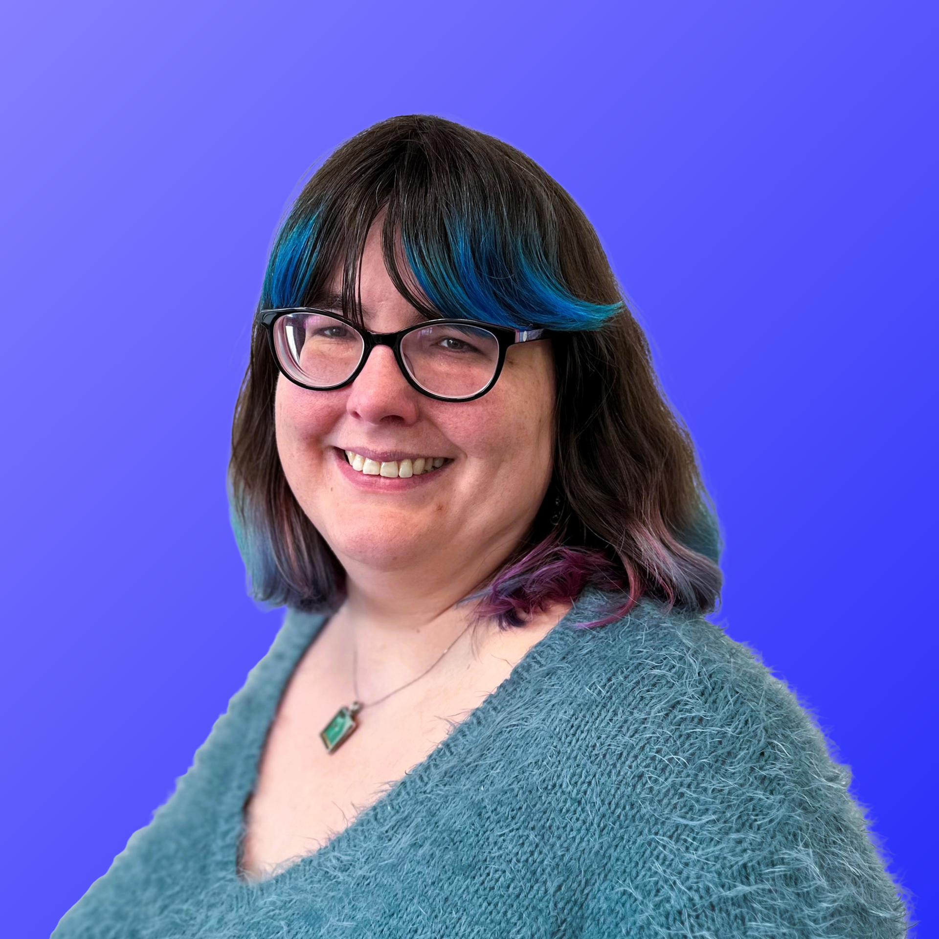 A  woman against a blue background.