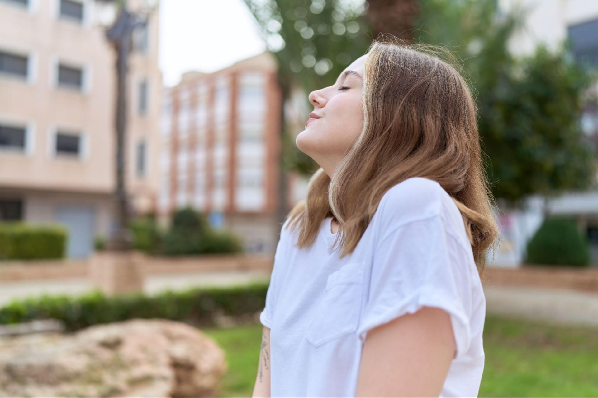 A woman enjoys the outdoors in spring after her immunotherapy appointment, effectively improving her oak allergy symptoms.