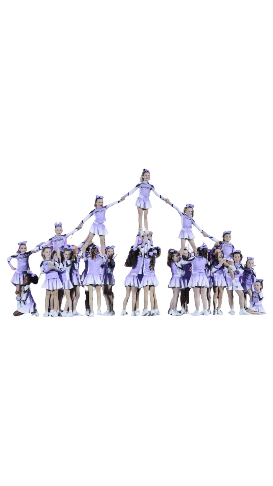 A group of cheerleaders are standing next to each other on a white background.