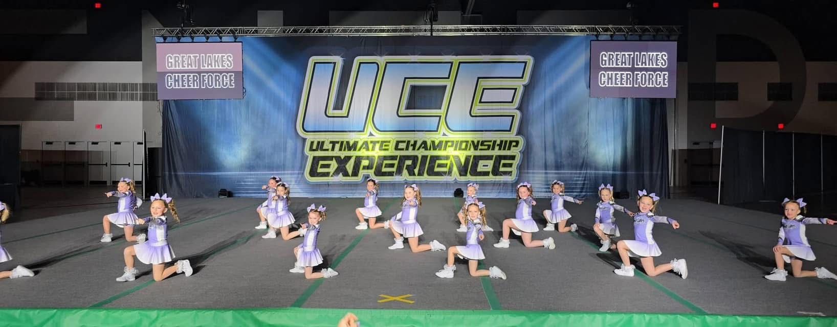 A group of cheerleaders are performing on a stage.