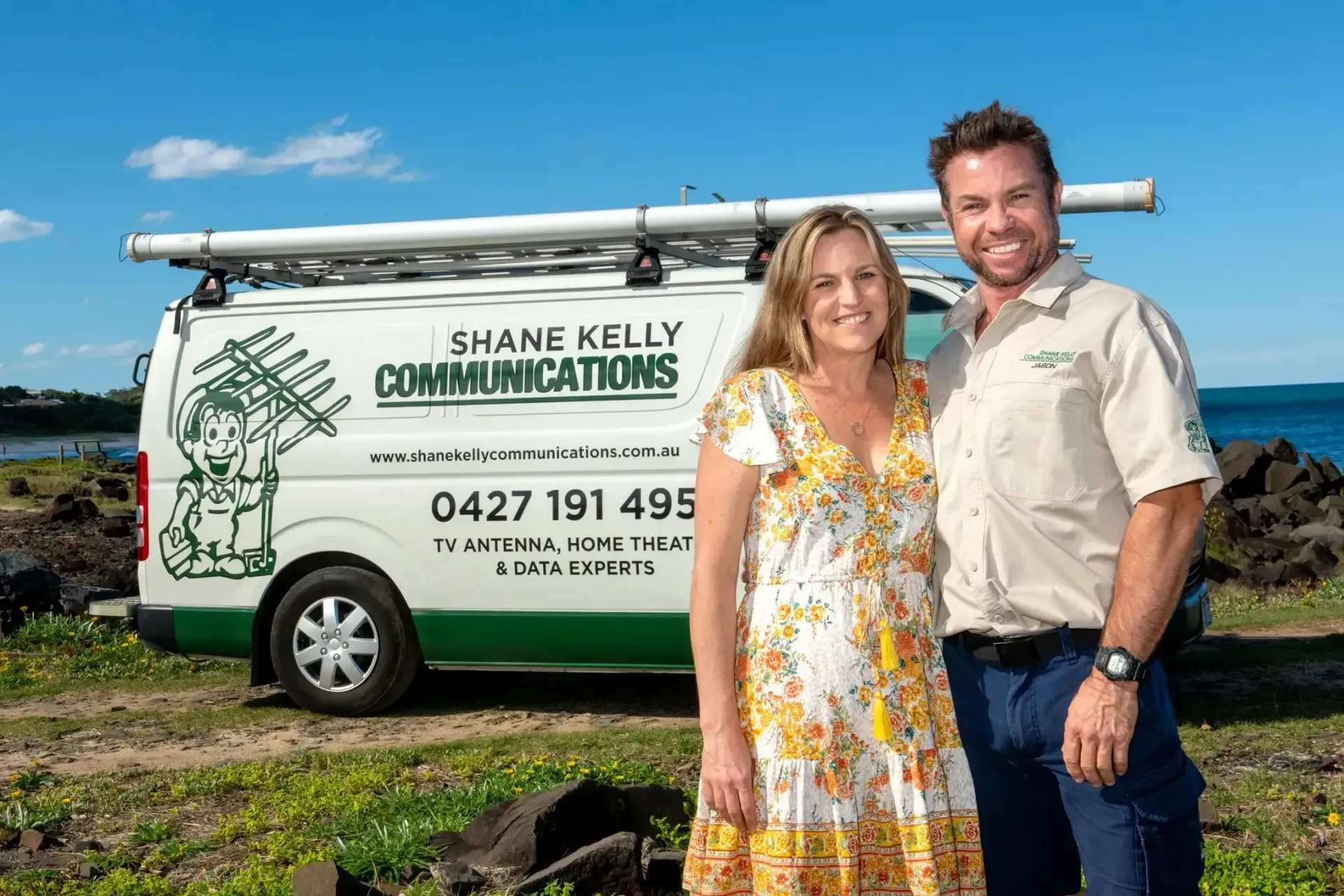 Man And Woman Stand Near A Van With Business Logo — Shane Kelly Communications in Northern Rivers, NSW