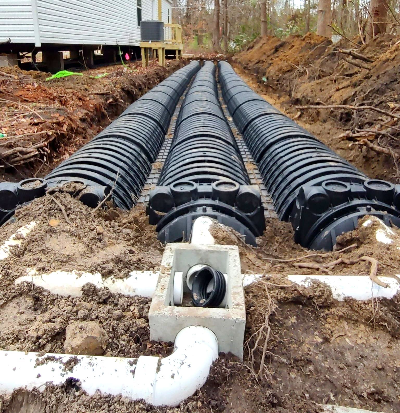 A drainage system is being built in the dirt