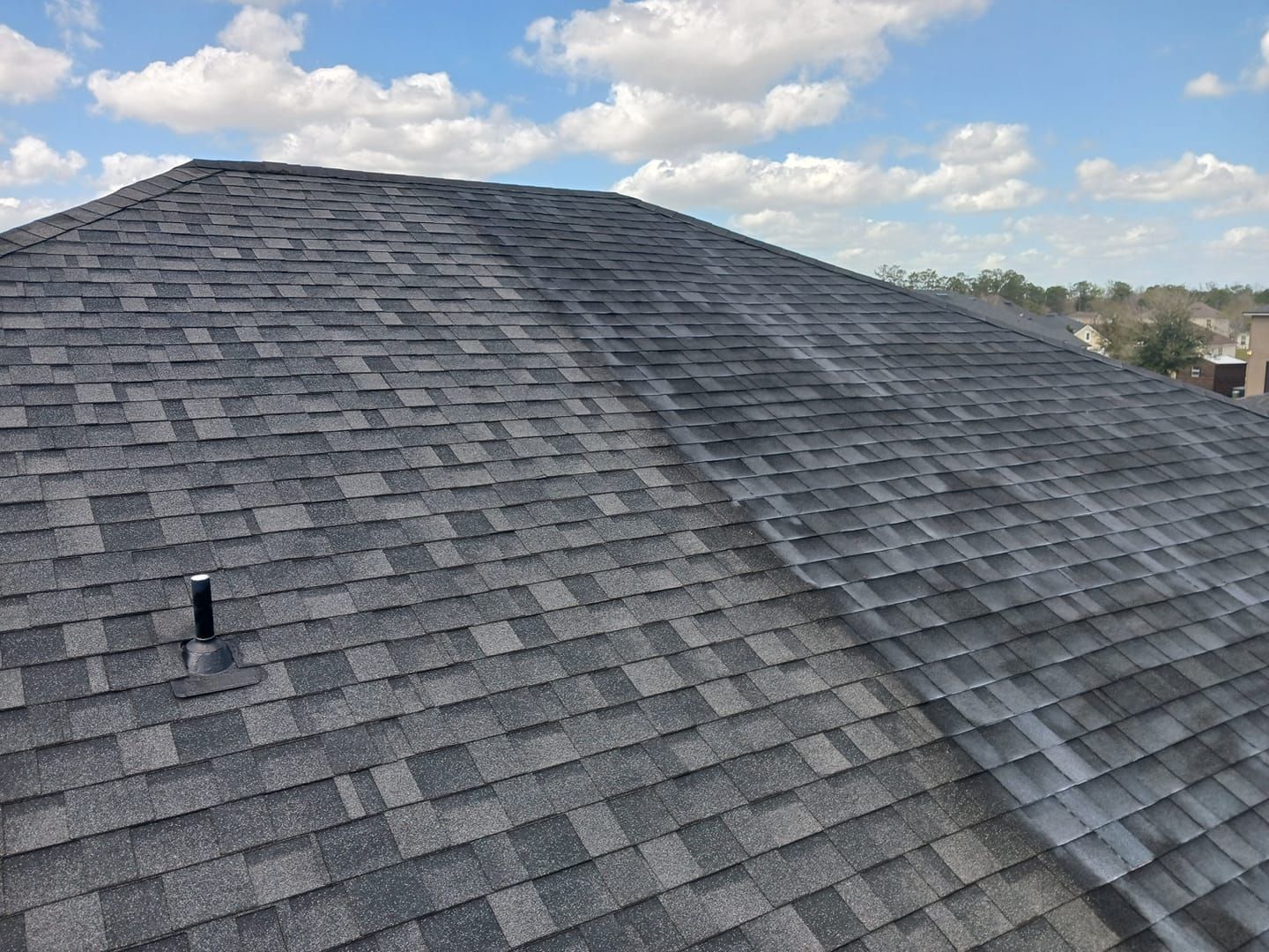 A roof with a lot of shingles and a chimney on it