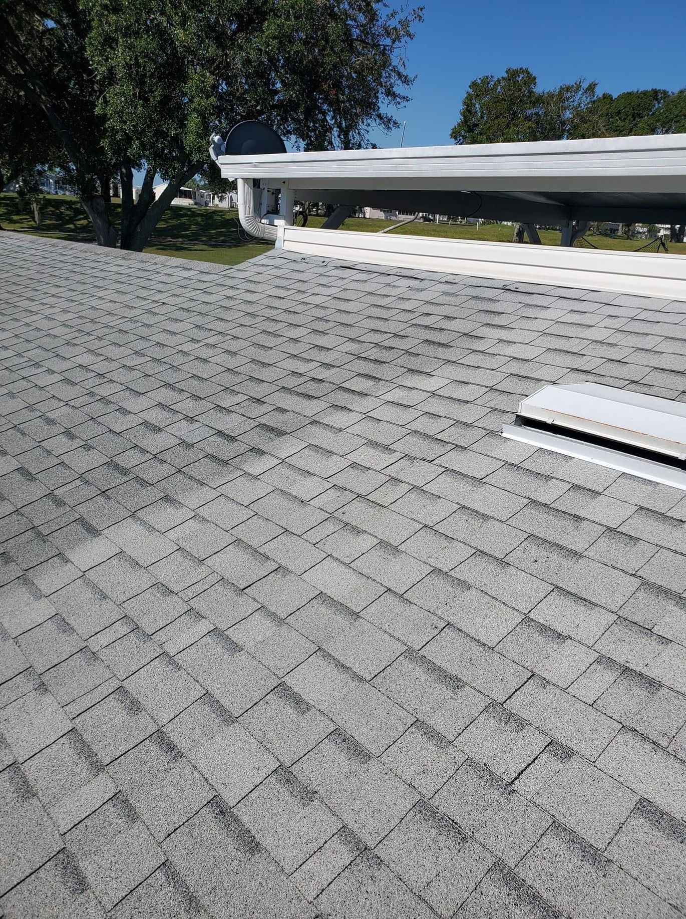 A close up of a roof rejuvenation spray