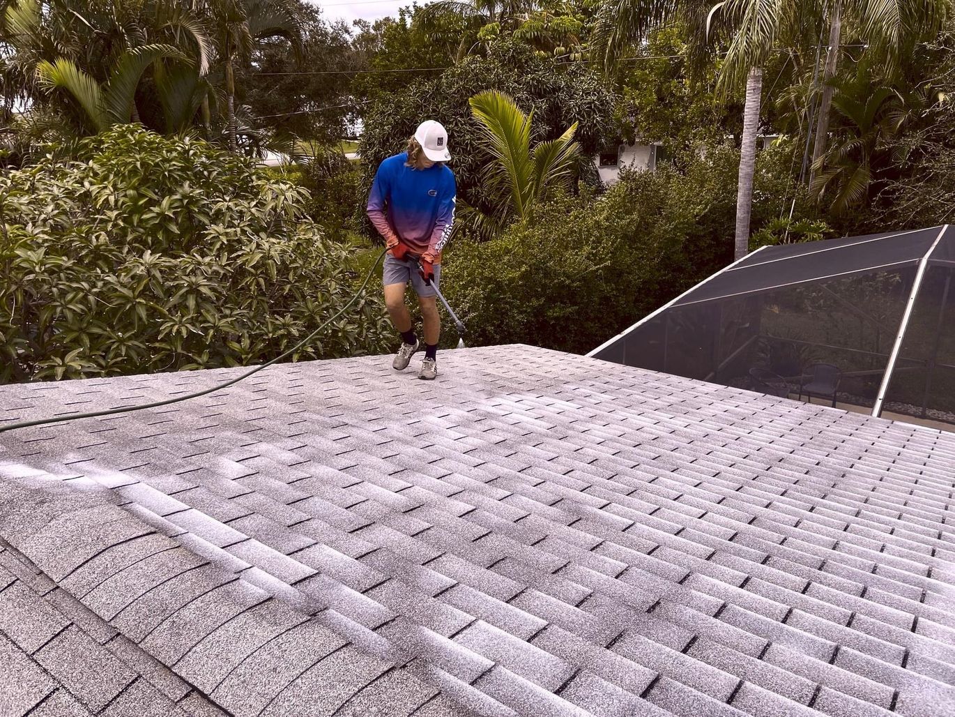 A man is rejuvenation the roof of a house with Fresh Roof