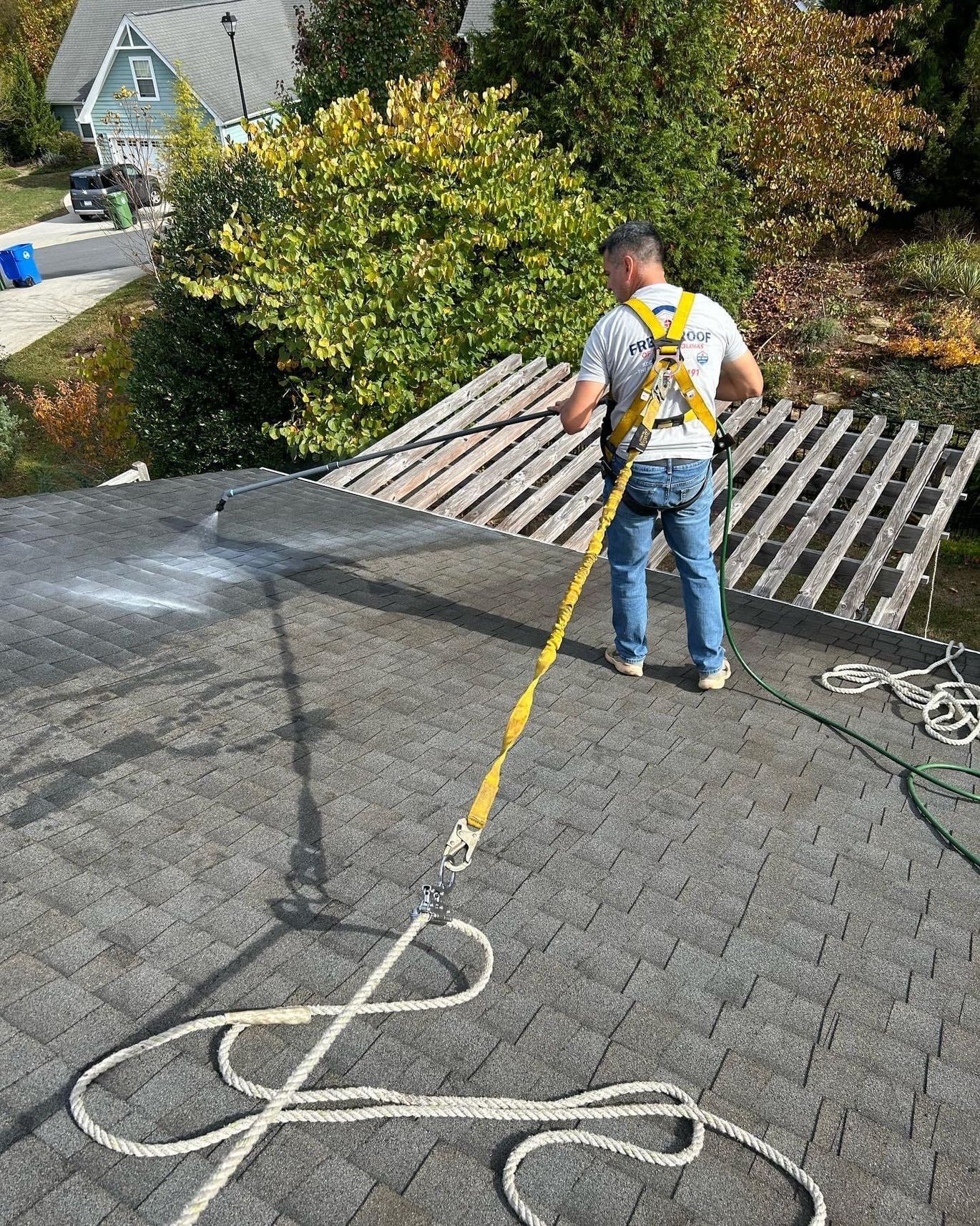 A man is doing a roof restoration  