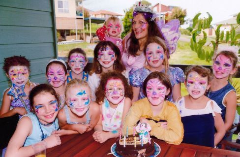 children at a party with their face painted