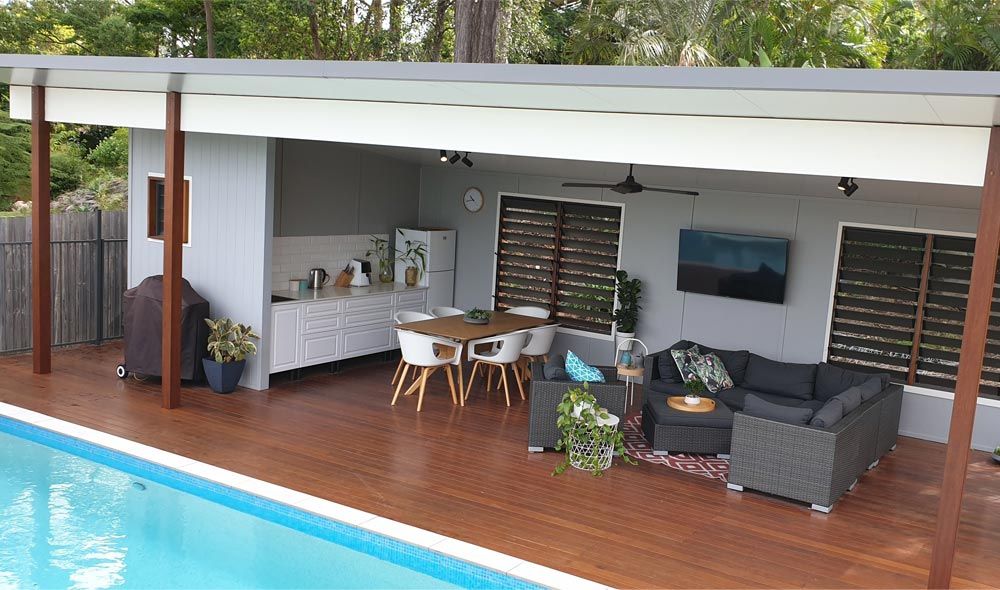 patio furniture next to pool