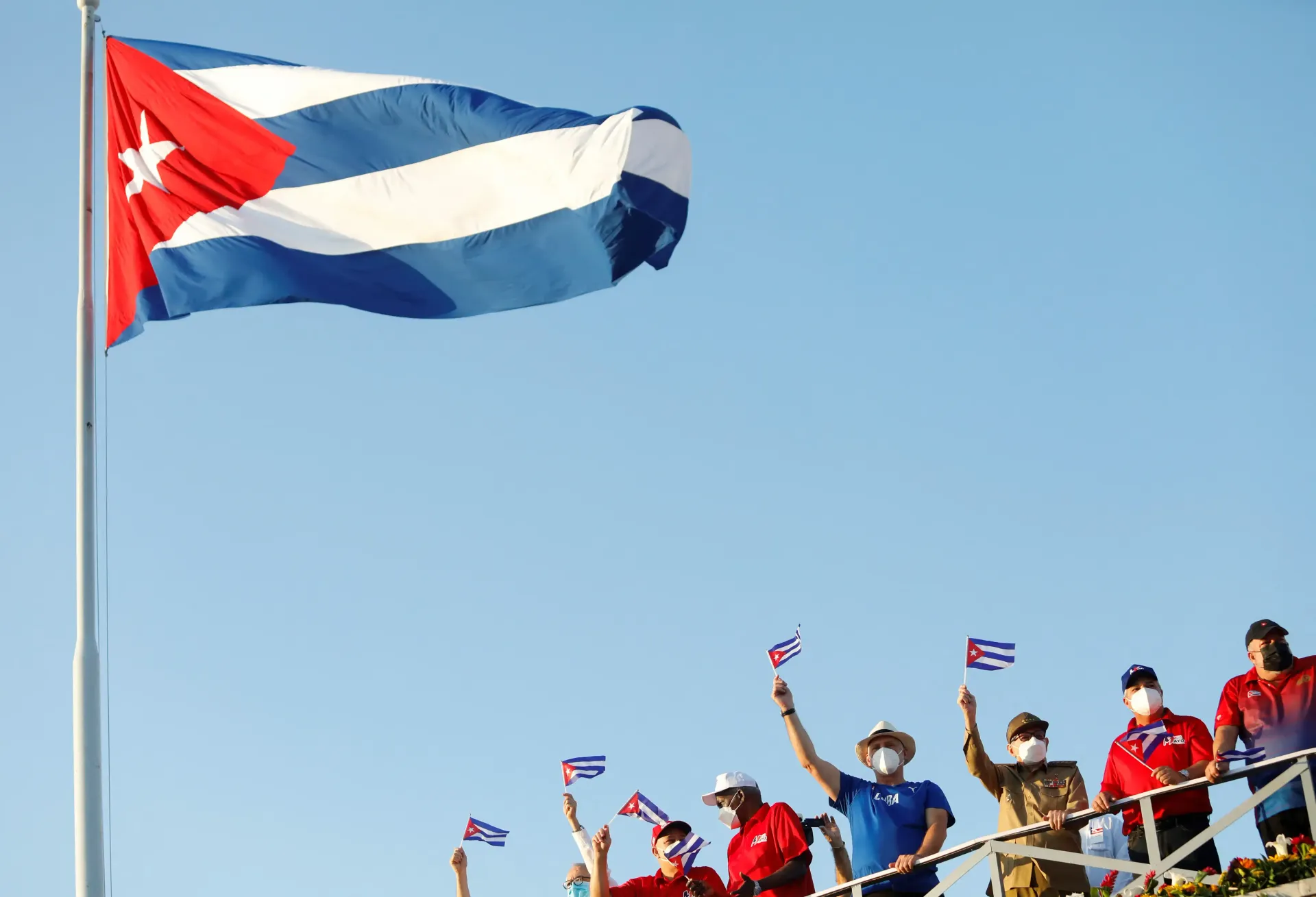 Cuban flag with people showing national pride and global relations influence