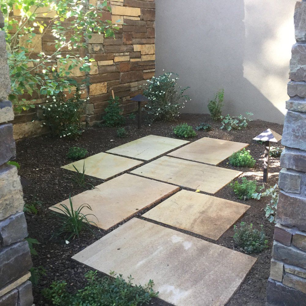 Professional Lawn Care — Beautiful Landscape in Small Garden with Tiles in Flagstaff, AZ