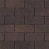 Close-up of brown, rectangular asphalt roof shingles arranged in an overlapping, offset brick-like pattern.