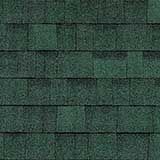 A close-up of dark green, rectangular asphalt shingles installed in an overlapping, horizontal pattern.