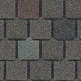 A seamless pattern of dark gray, rectangular asphalt roof shingles with subtle variations in charcoal and slate blue tones.