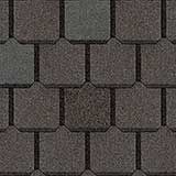 A close-up, top-down view of dark gray, rectangular asphalt roof shingles arranged in a staggered, repeating pattern.