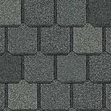 A close-up of dark grey, square-cut asphalt roofing shingles arranged in a repeating, overlapping pattern.