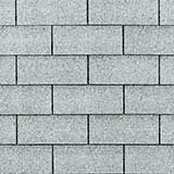 A seamless texture of grey rectangular paving stones arranged in a standard running bond pattern.