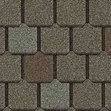 A repeating pattern of dark, slate-grey architectural roof shingles with a textured, granulated surface.