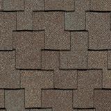 Close-up of overlapping brown asphalt roof shingles with a textured, layered pattern.
