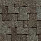 Close-up of asphalt architectural roof shingles in overlapping shades of charcoal gray, brown, and tan.