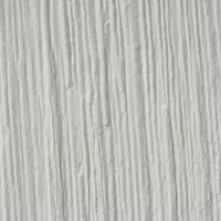 A close-up view of white, vertical textured stripes resembling brushed paint or plaster.