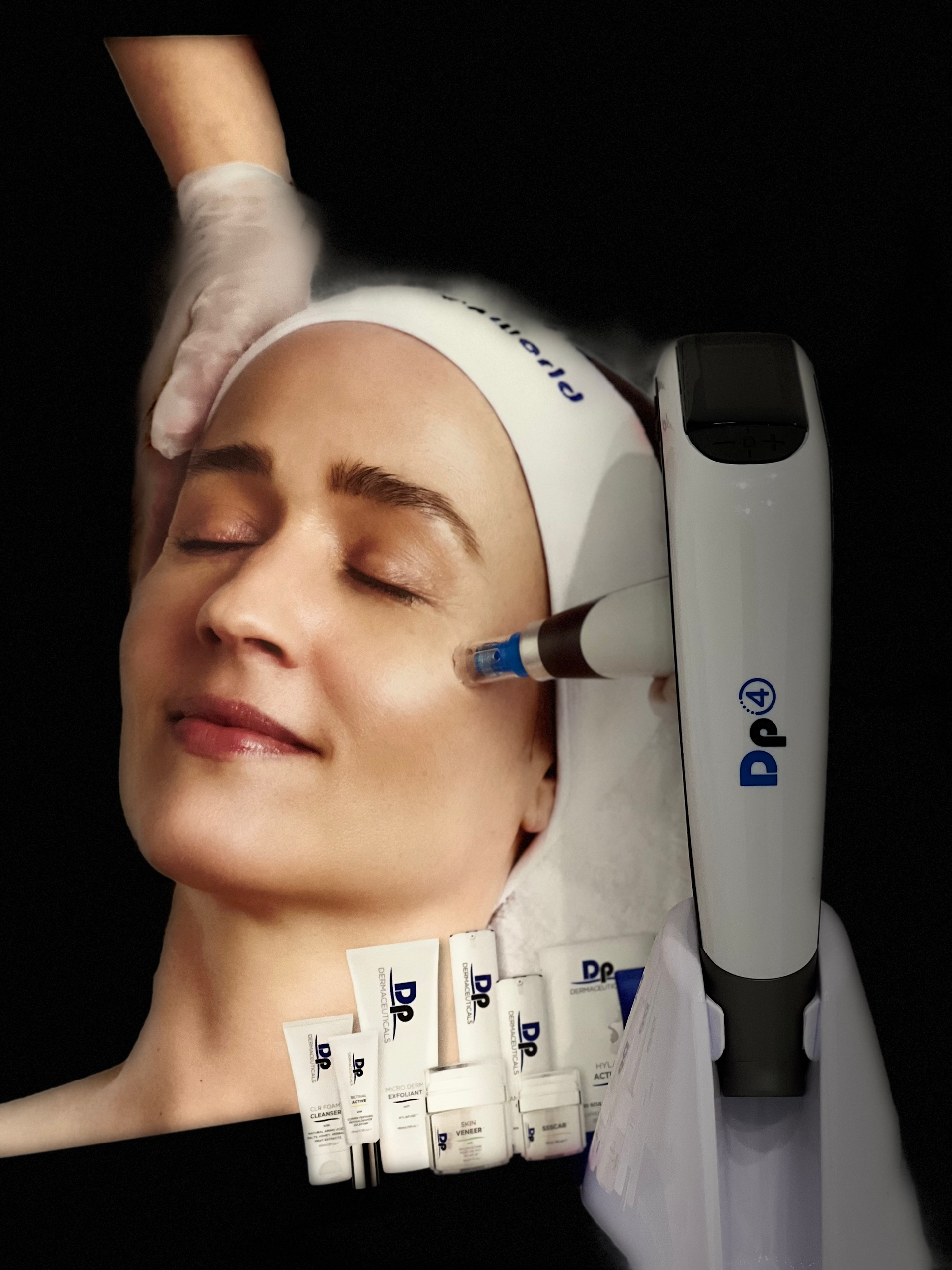 A woman is getting a dp treatment on her face
