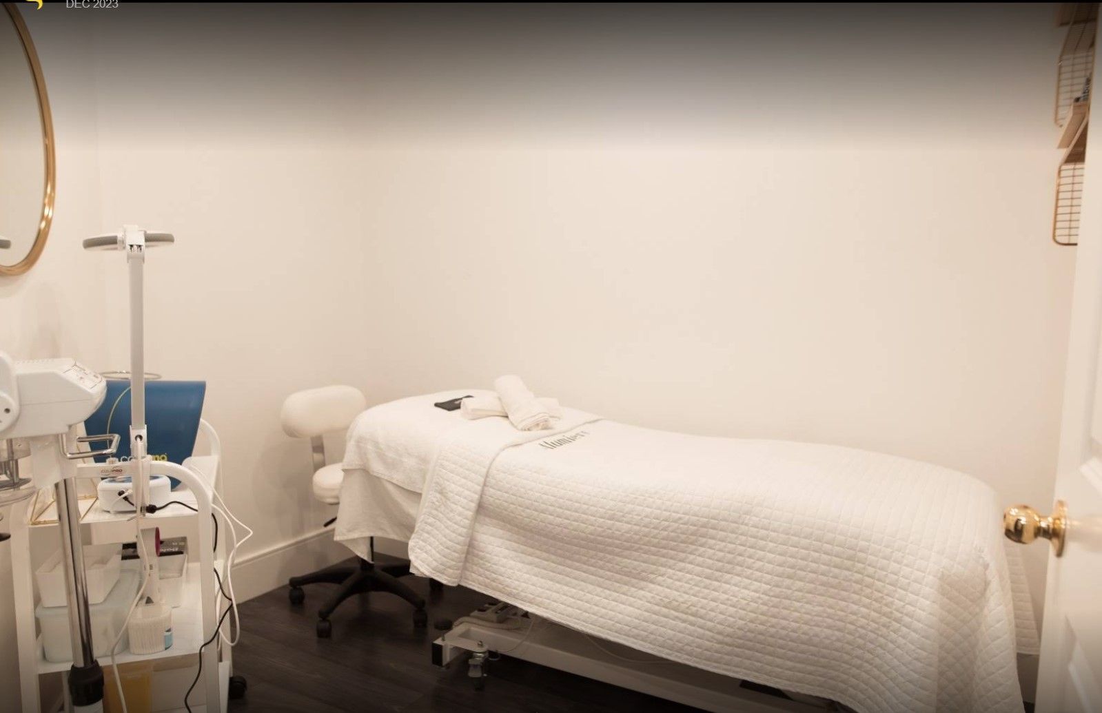 There is a massage table in the middle of the room.
