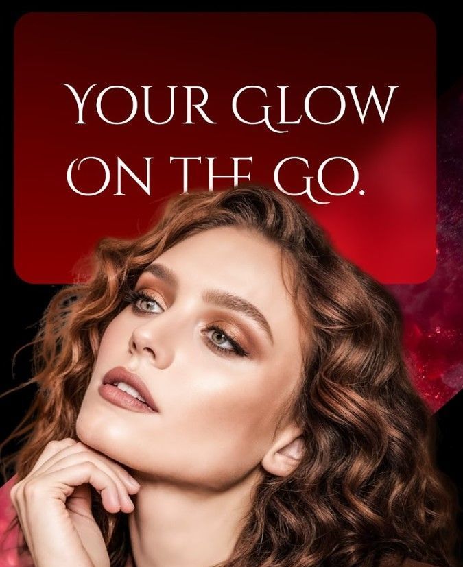 A woman with curly hair is standing in front of a sign that says your glow on the go