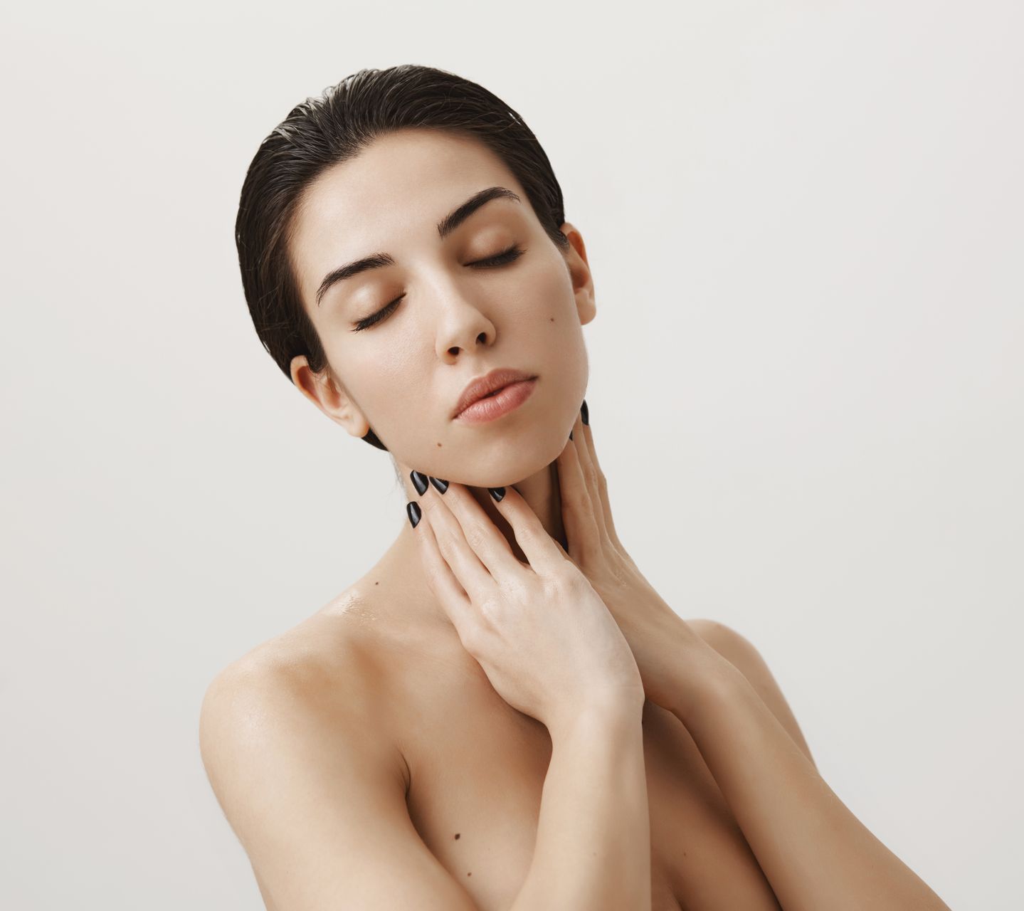woman touching her face
