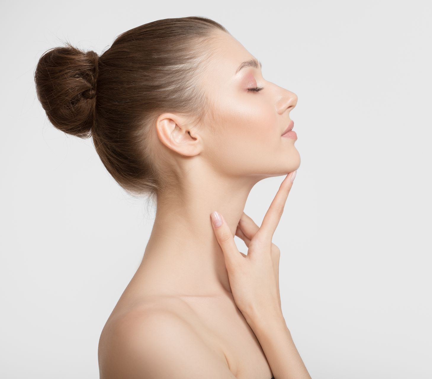 woman touching her face