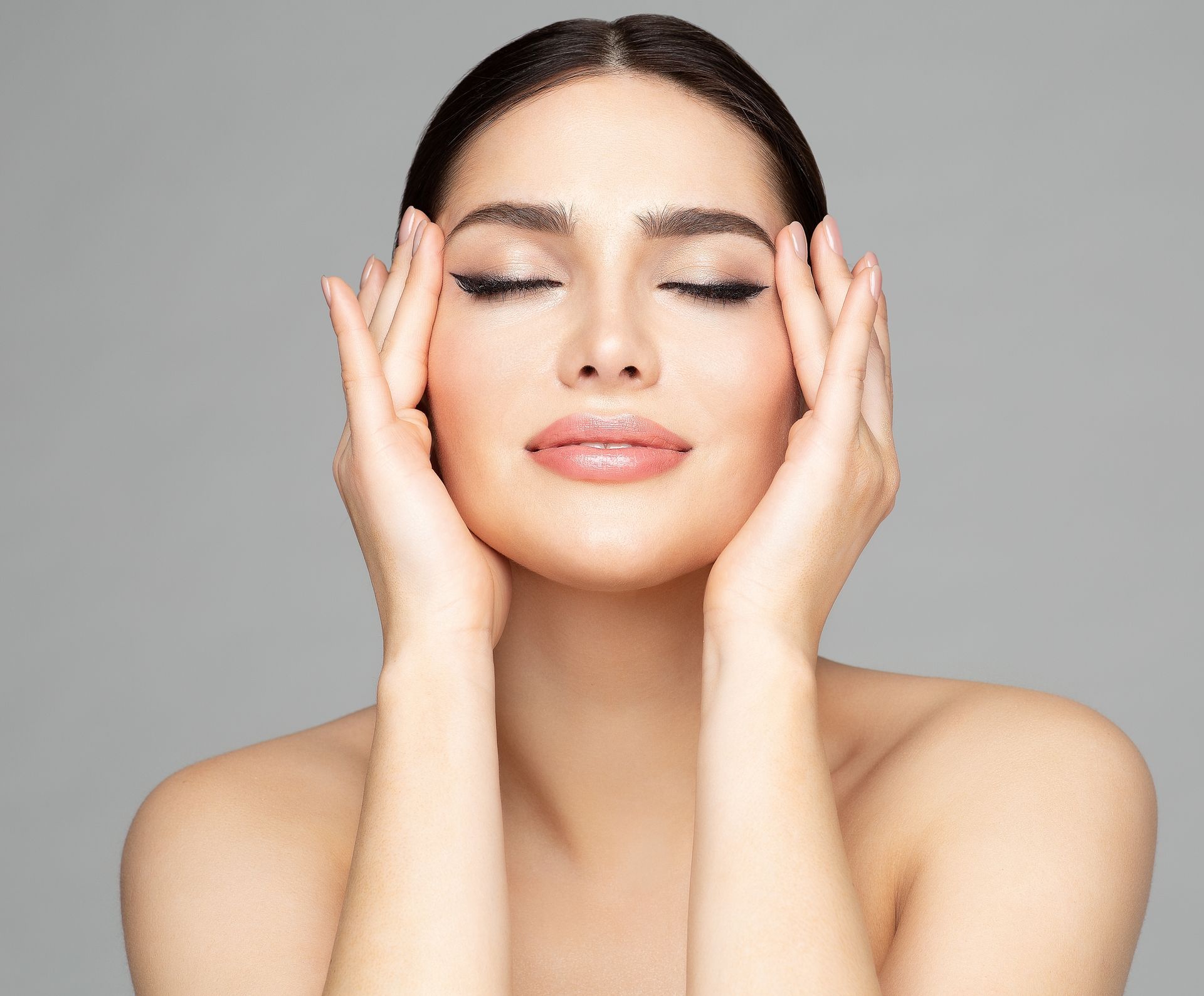 woman touching her face