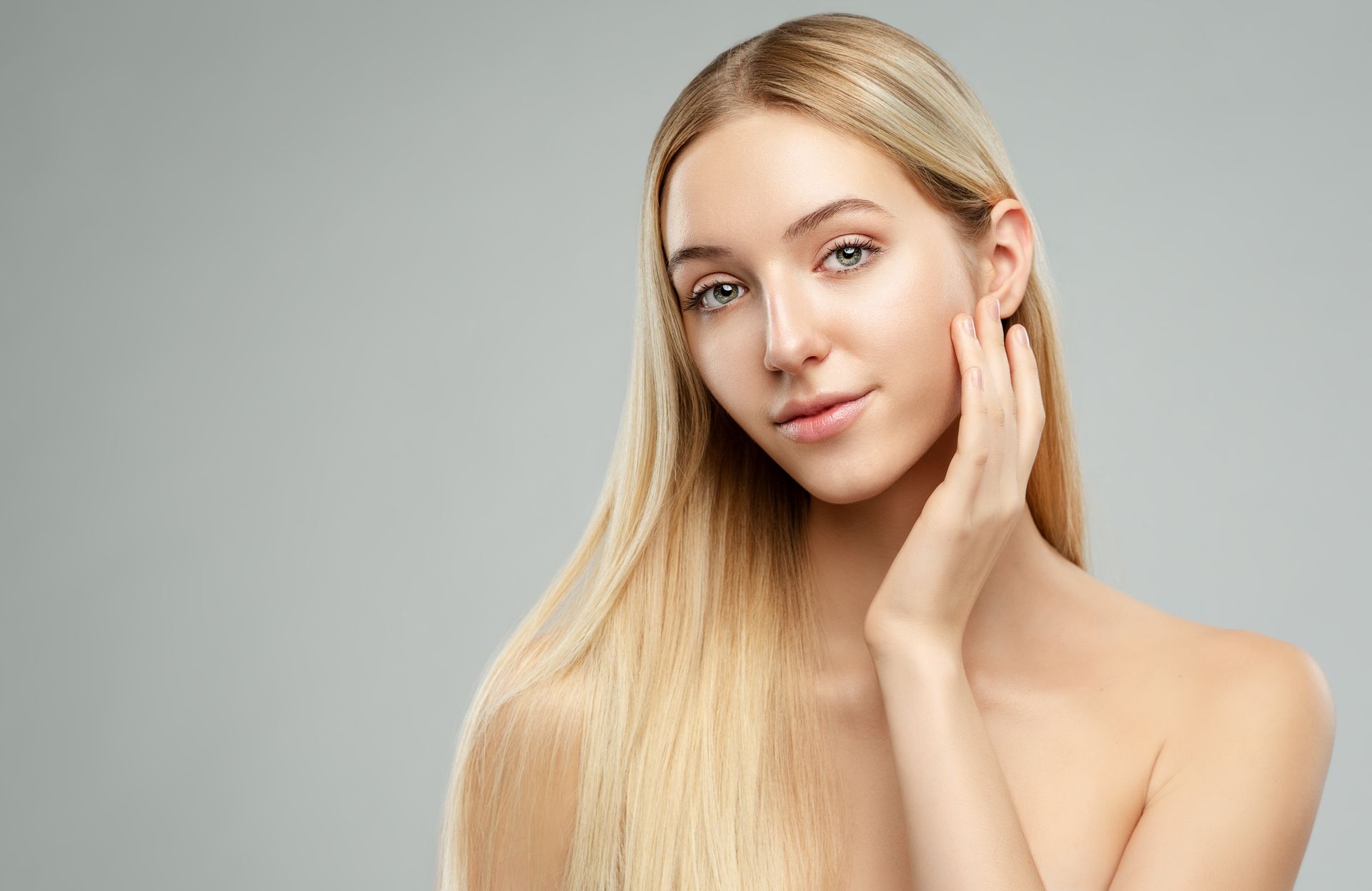 woman touching her face