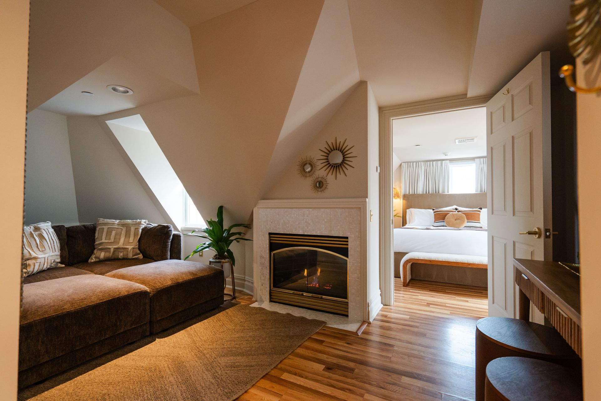 A bed with white sheets and a book on it.