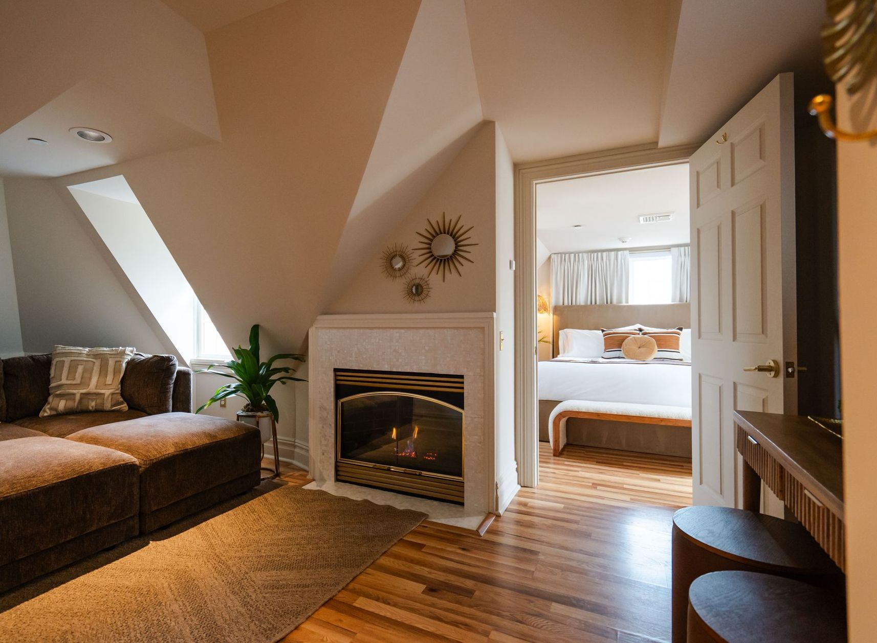 A bed with white sheets and a book on it.