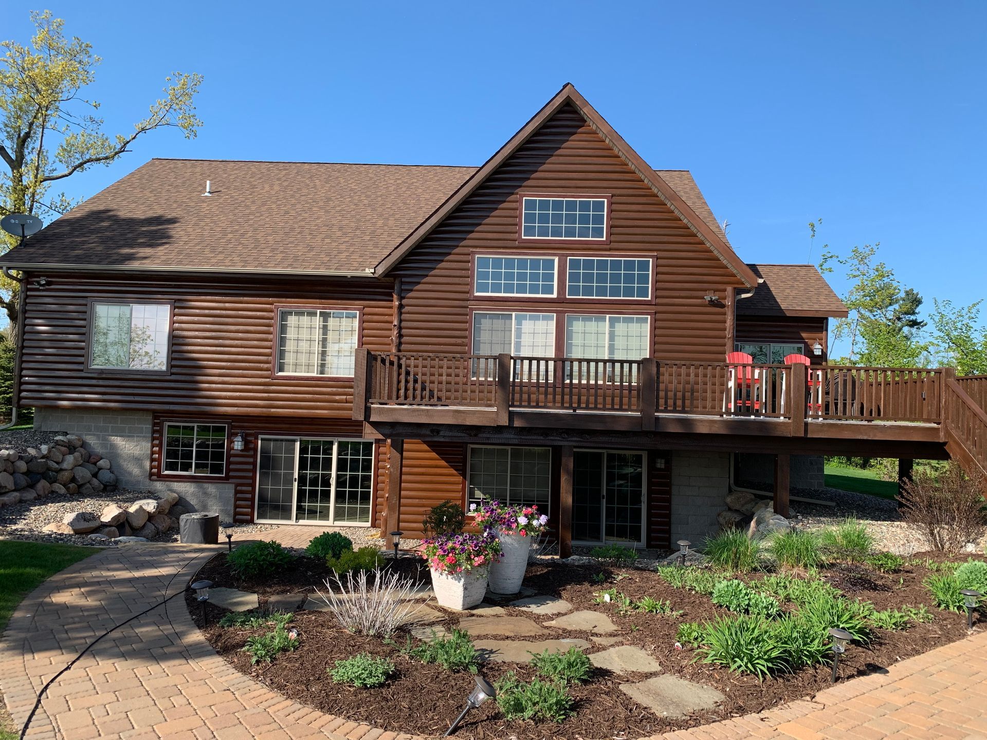 A Large Wooden House With a Large Deck – MN - Lifetime Staining and Log Restoration