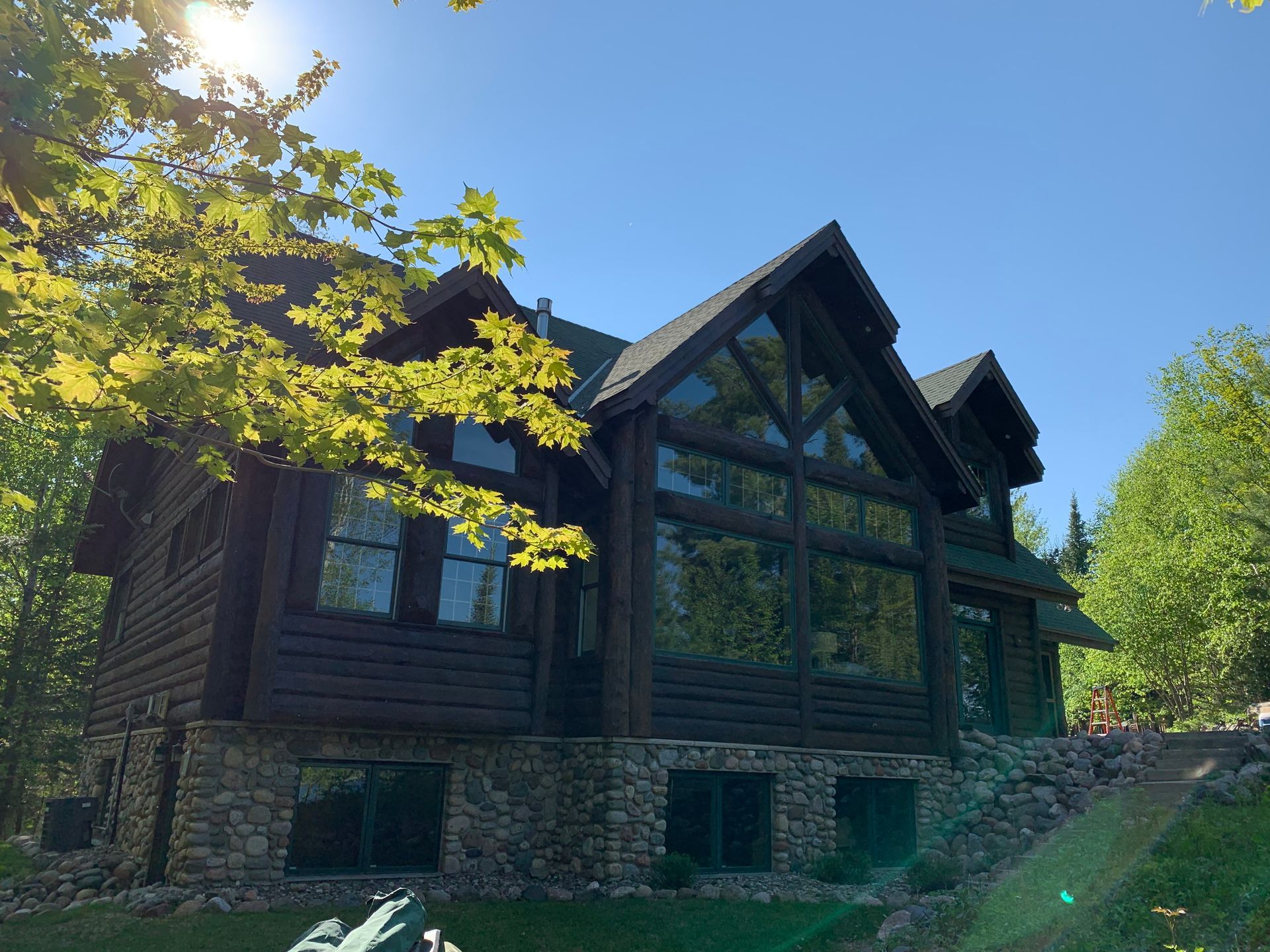 House With a Lot of Windows – MN - Lifetime Staining and Log Restoration