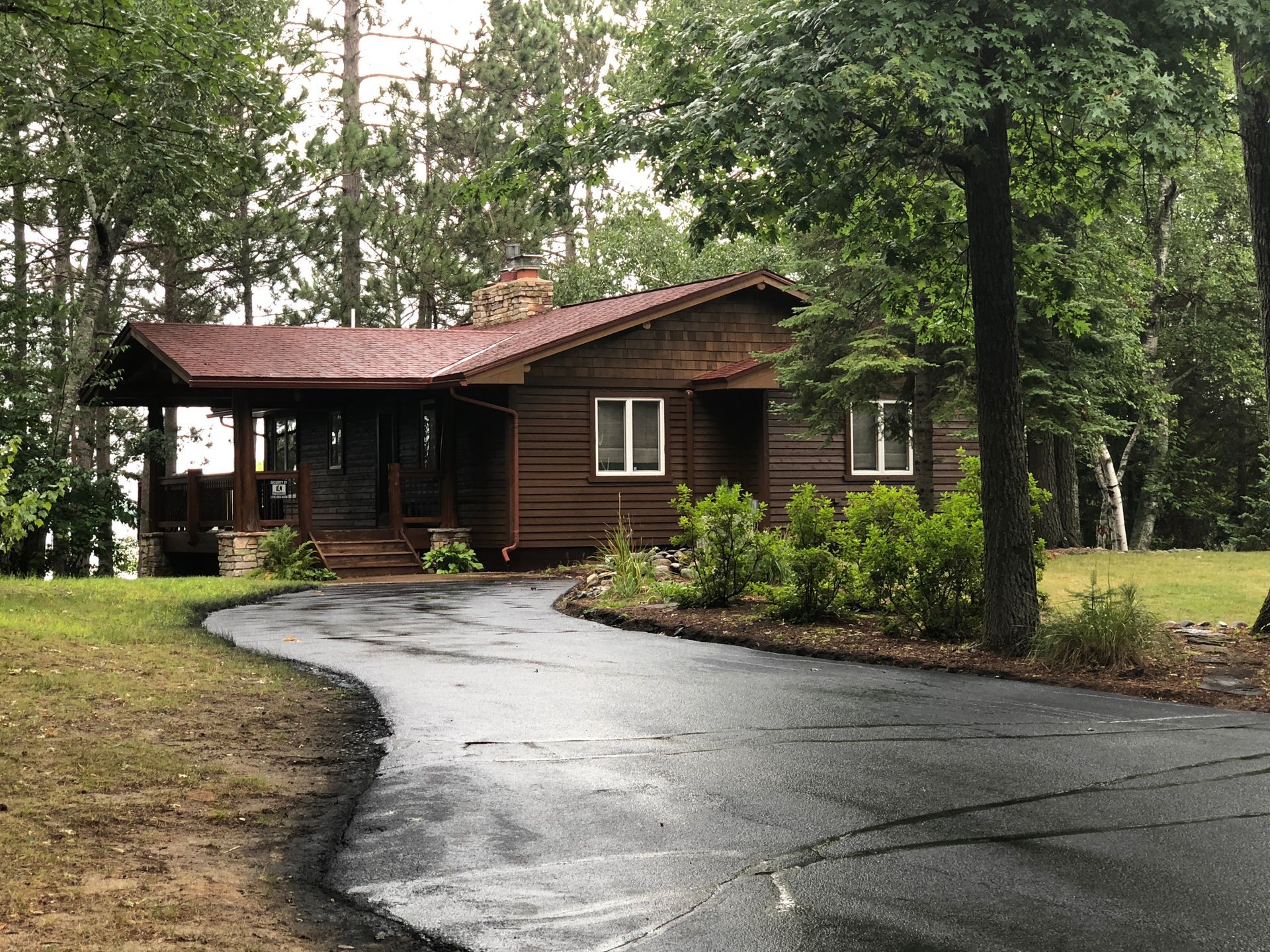 A Log Cabin With a Driveway – MN - Lifetime Staining and Log Restoration