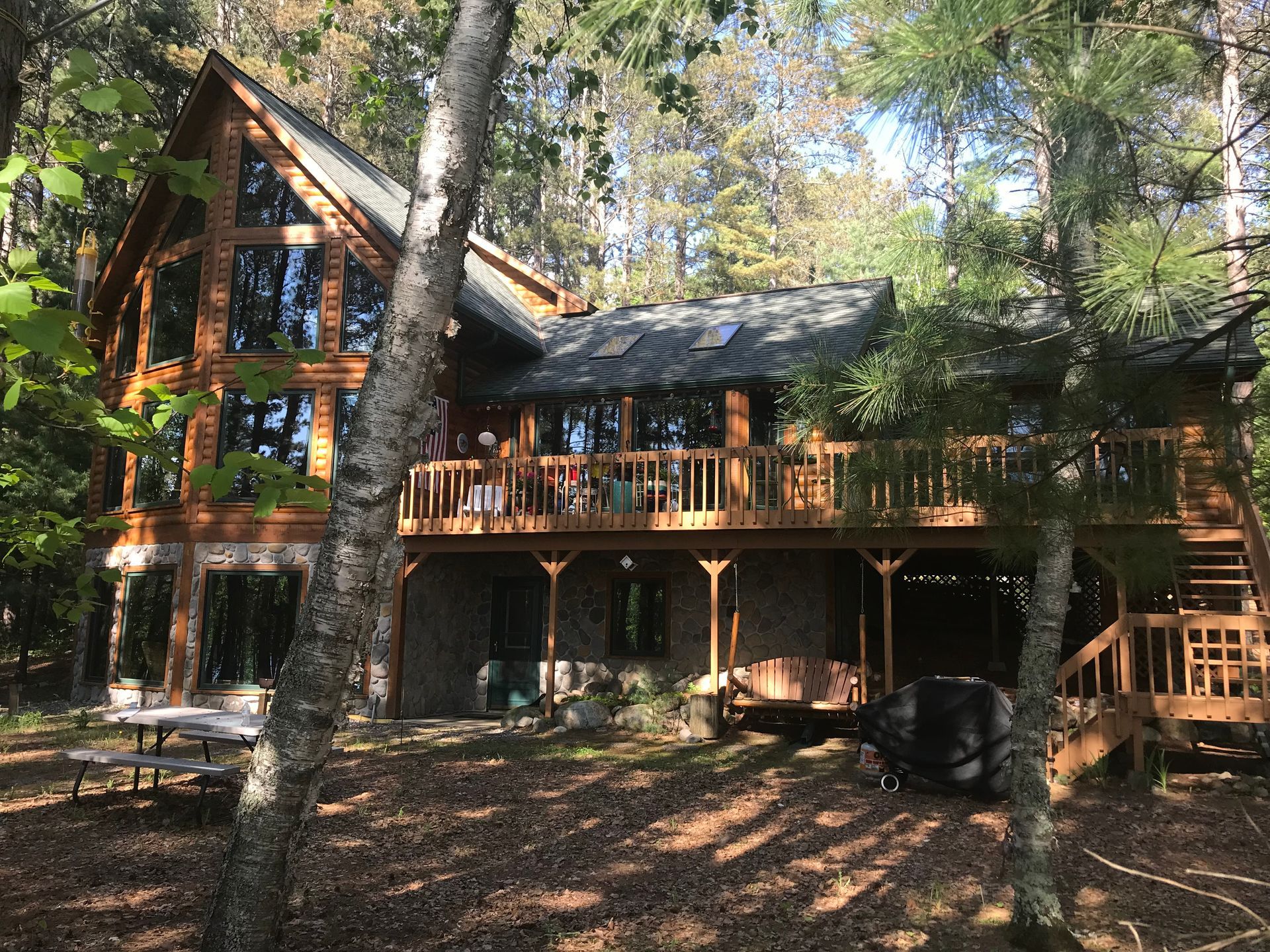 Log Cabin With a Deck – MN - Lifetime Staining and Log Restoration