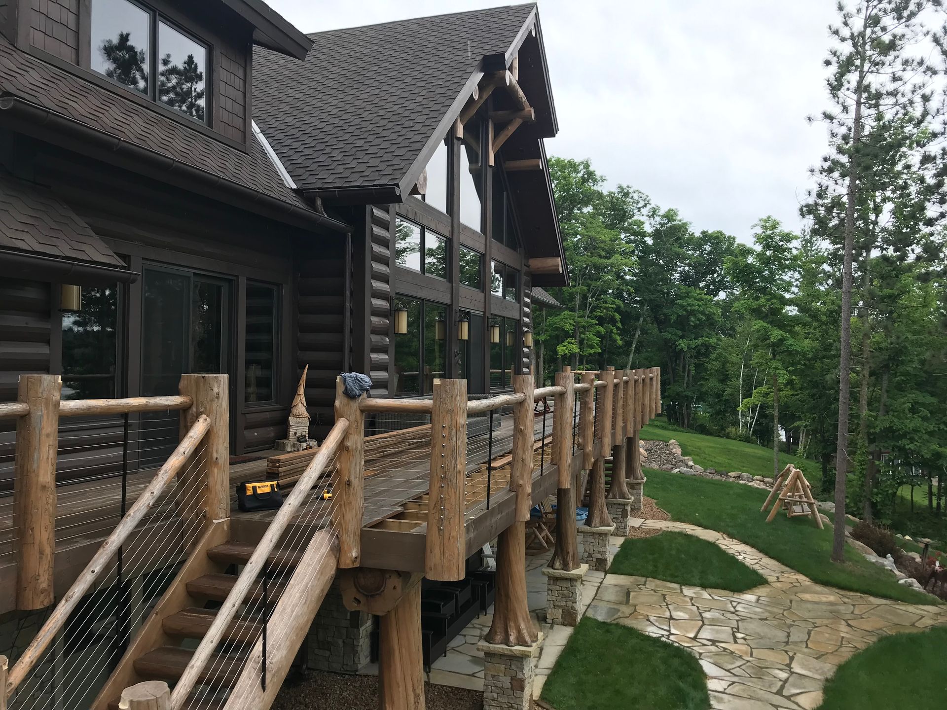 Cabin With a Large Deck and Stairs – MN - Lifetime Staining and Log Restoration