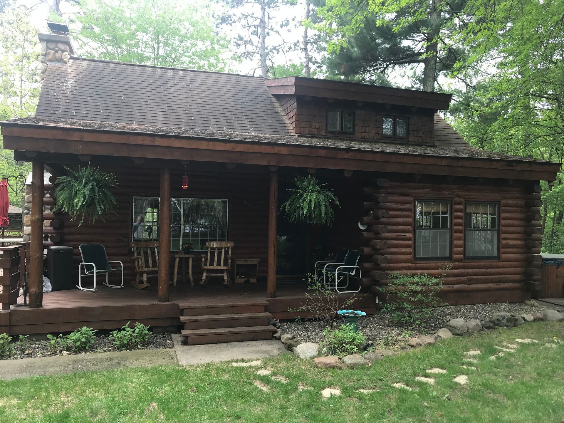 A Log Cabin With a Porch – MN - Lifetime Staining and Log Restoration