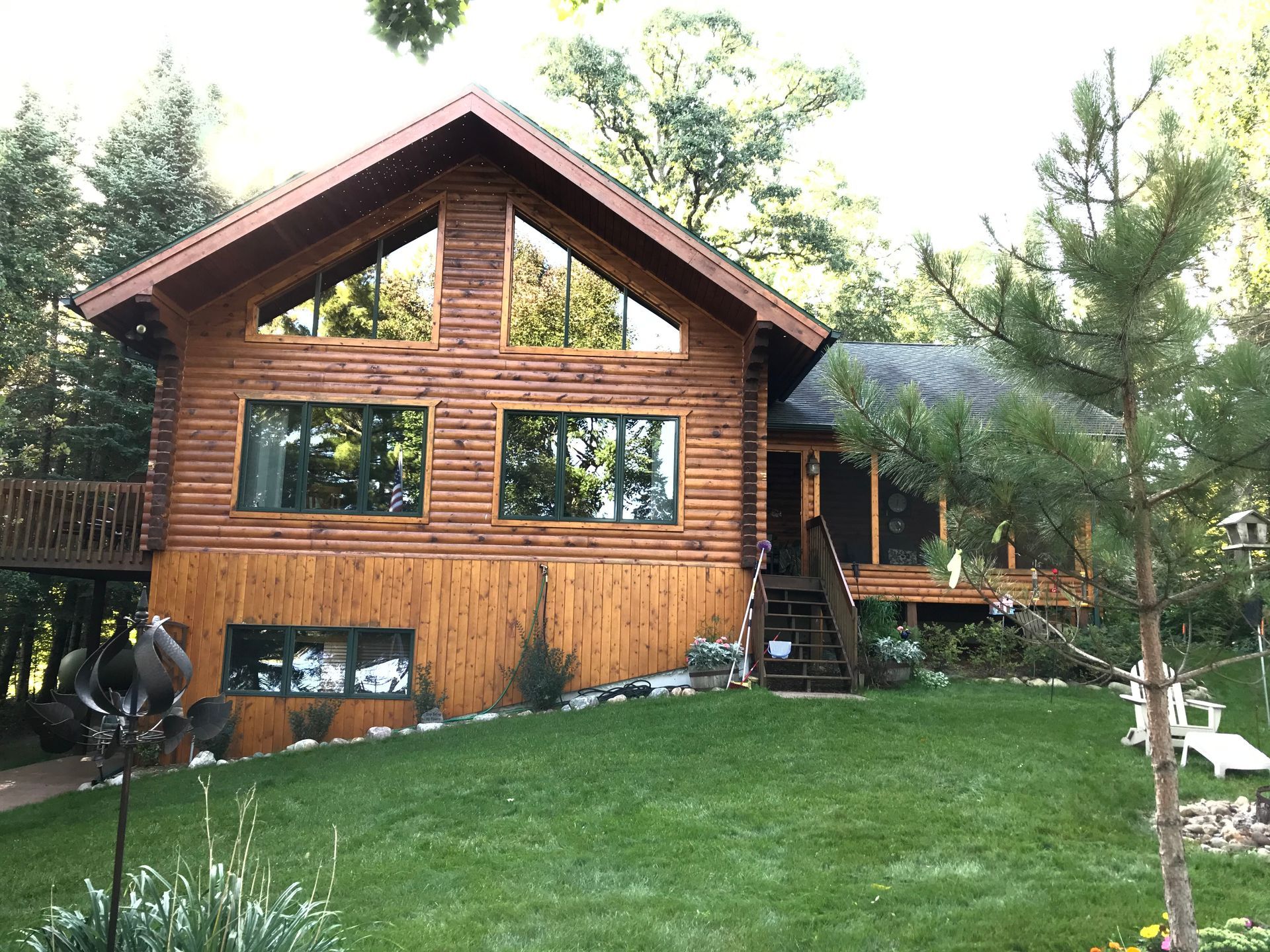 A Large Log Cabin With a Lawn – MN - Lifetime Staining and Log Restoration