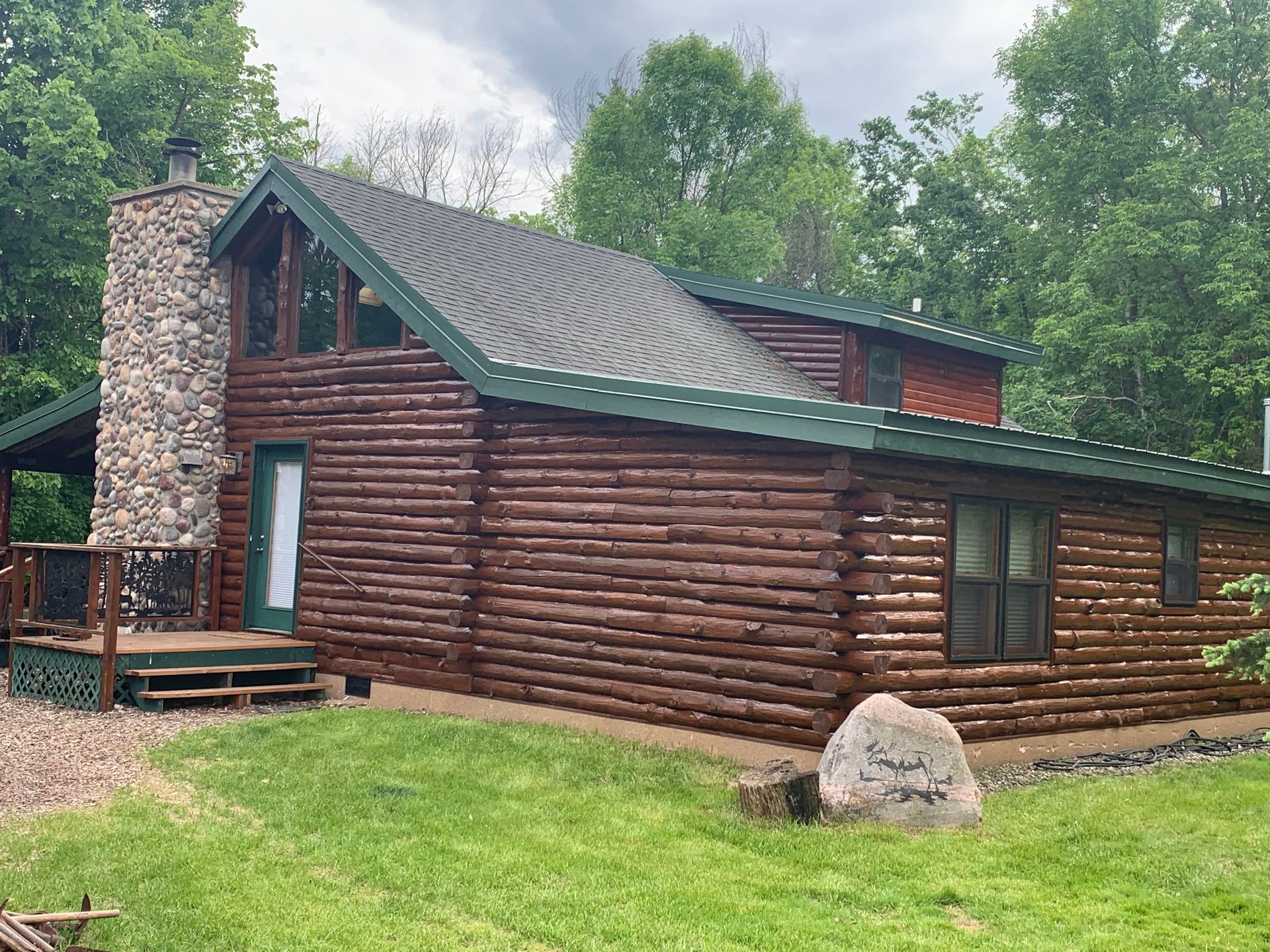 A Log Cabin With a Stone – MN - Lifetime Staining and Log Restoration
