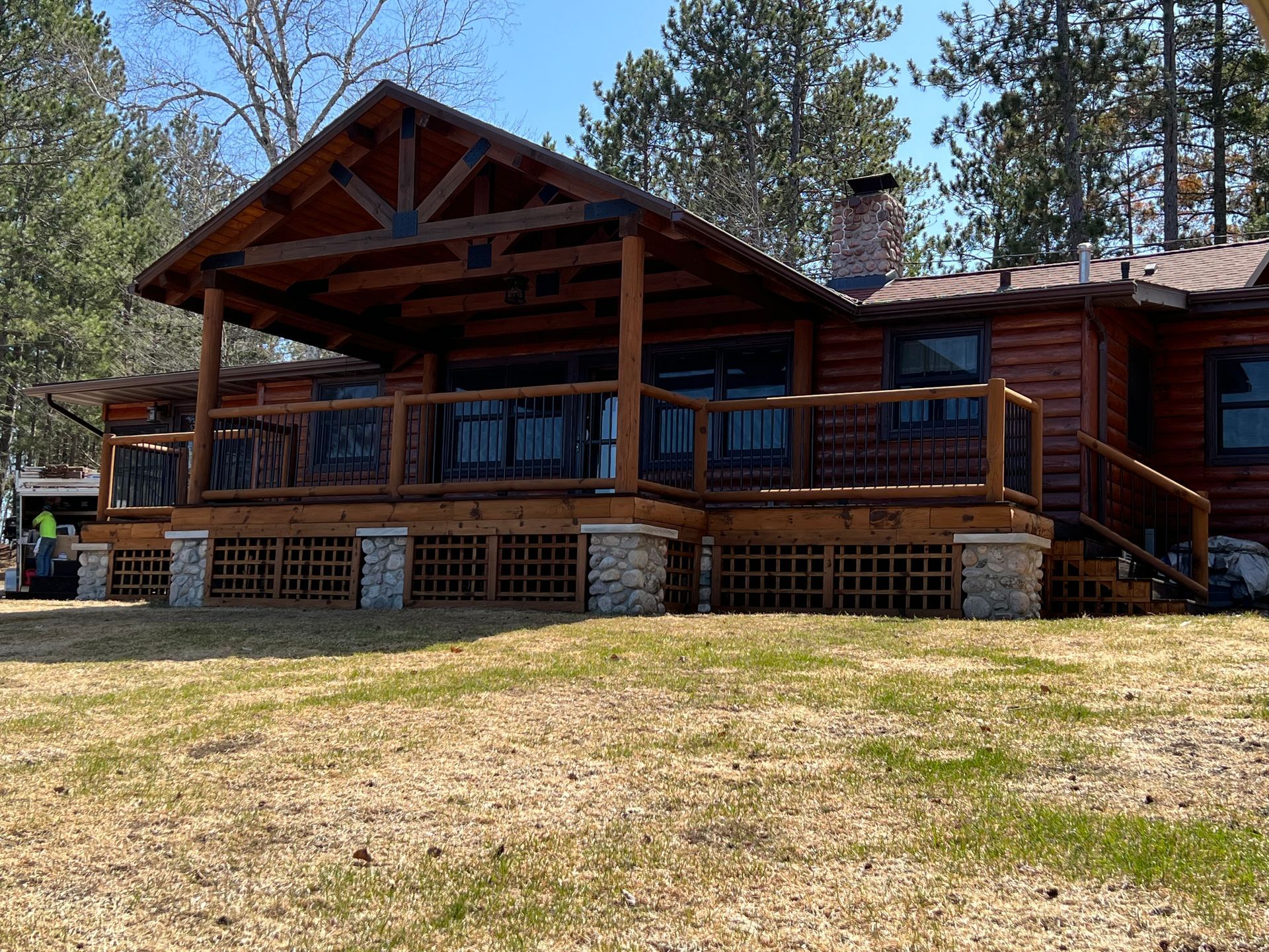 A Cabin With a Large Deck – MN - Lifetime Staining and Log Restoration
