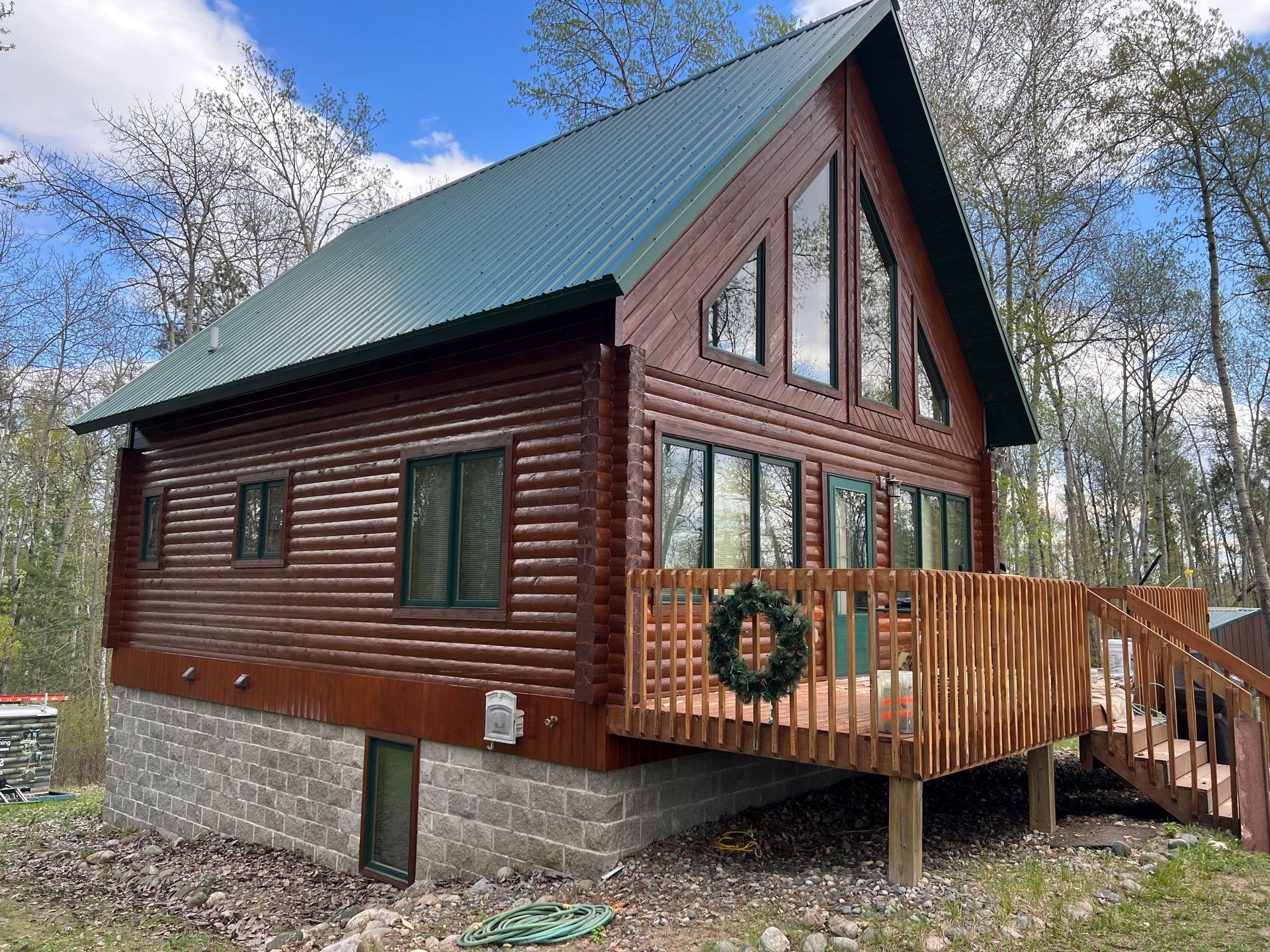 A Log Cabin With a Large Deck – MN - Lifetime Staining and Log Restoration